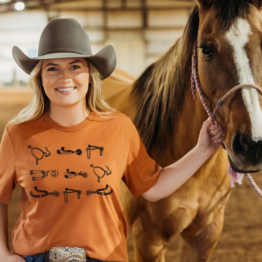 orange tshirt with spurs on front