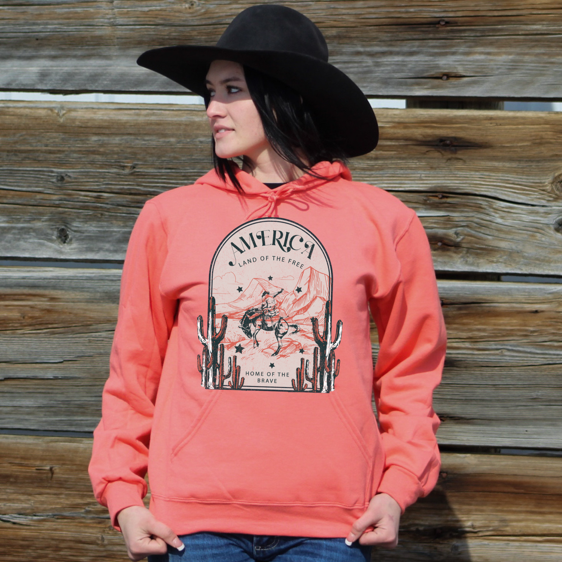Girl wearing America land of the free home of the brave hoodie. 
