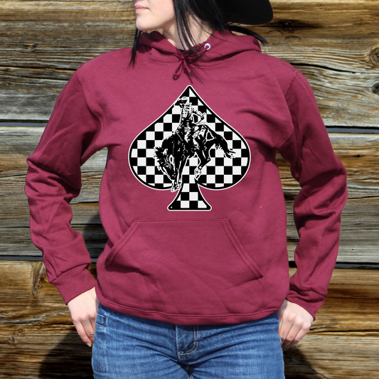 woman wearing maroon hoodie with black and white checkered spade design with bucking horse in the middle